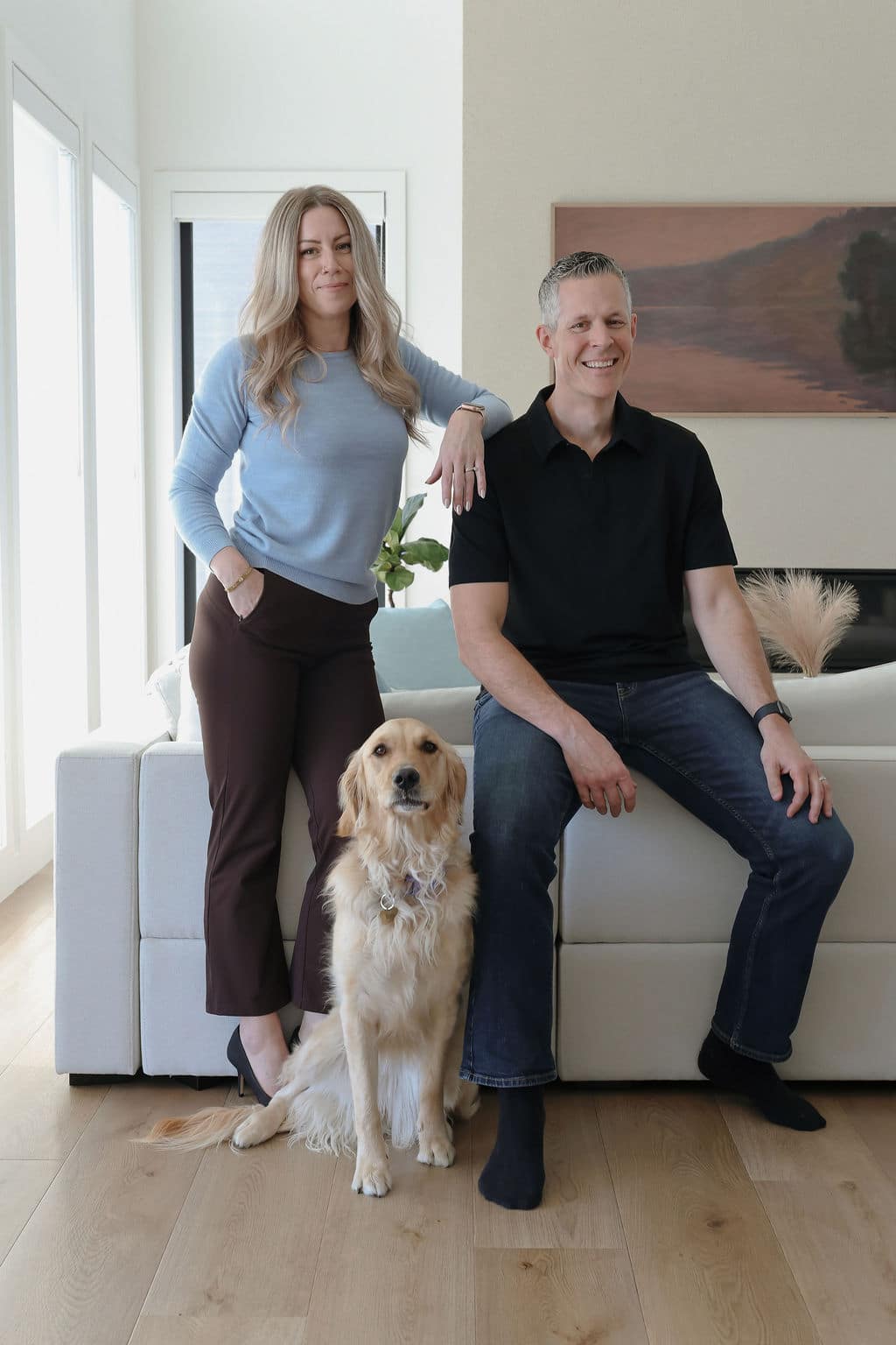 Robb Engen and Lindsay Engen Robb Engen and Lindsay Engen with dog sitting on couch at home